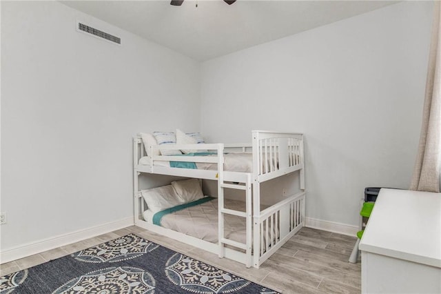 bedroom featuring hardwood / wood-style floors and ceiling fan