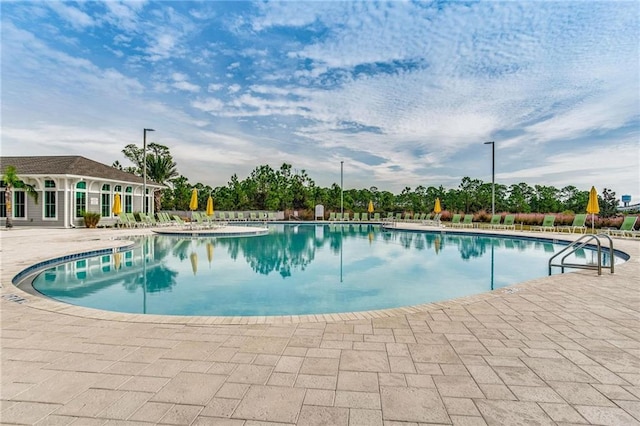 view of pool featuring a patio area