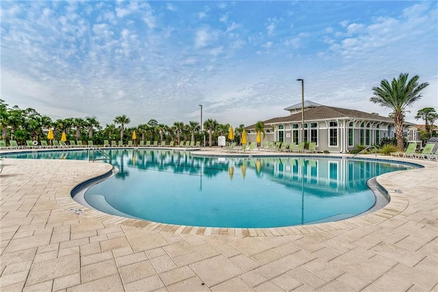 view of swimming pool featuring a patio