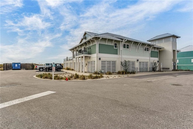 612 Lost Key Dr Unit 205B, Pensacola, FL 32507 - view of front of house with metal roof and a standing seam roof