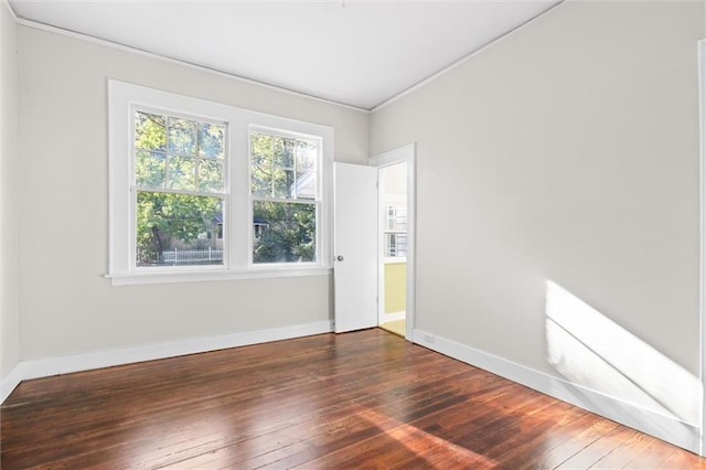 empty room with dark hardwood / wood-style floors