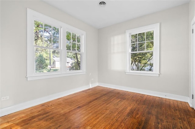 unfurnished room featuring hardwood / wood-style floors