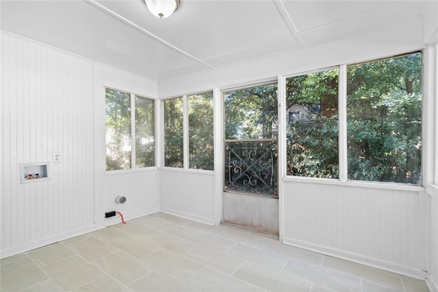 unfurnished sunroom featuring a healthy amount of sunlight