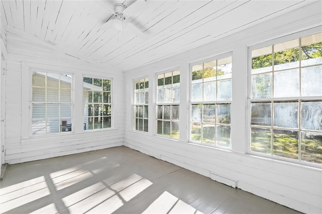 unfurnished sunroom with lofted ceiling, ceiling fan, and wooden ceiling