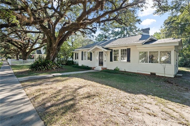 single story home featuring a sunroom