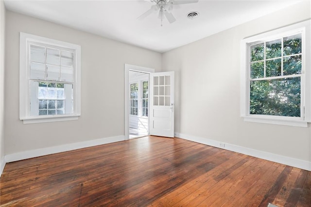 unfurnished room with wood-type flooring and plenty of natural light