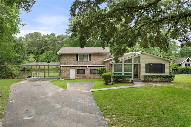 3765 Rabbit Creek Ct, Theodore, AL 36582 - view of front of property featuring a front yard, driveway, brick siding, and a carport