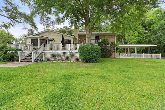 3765 Rabbit Creek Ct, Theodore, AL 36582 - view of front facade featuring a deck, a chimney, a front yard, and brick siding