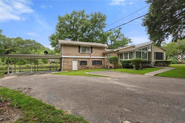 3765 Rabbit Creek Ct, Theodore, AL 36582 - view of front of home featuring brick siding, a front lawn, and asphalt driveway