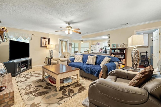 3765 Rabbit Creek Ct, Theodore, AL 36582 - living room with ceiling fan, crown molding, baseboards, and a textured ceiling