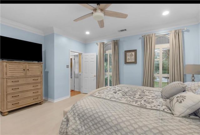 carpeted bedroom with ceiling fan and crown molding