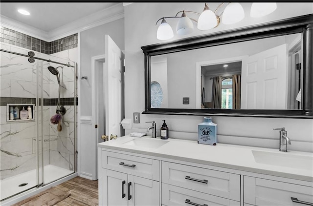 bathroom featuring ornamental molding, an enclosed shower, vanity, and wood-type flooring