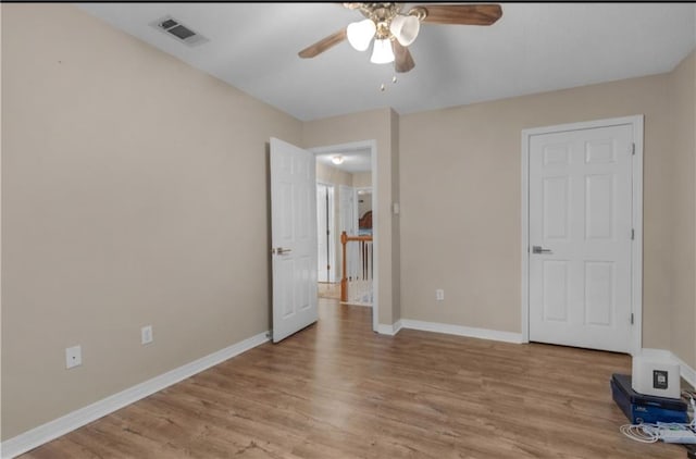 unfurnished bedroom featuring ceiling fan and light hardwood / wood-style flooring