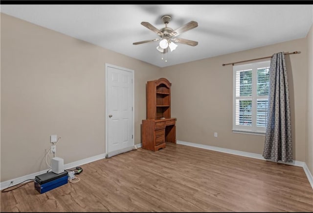 empty room featuring light hardwood / wood-style floors and ceiling fan