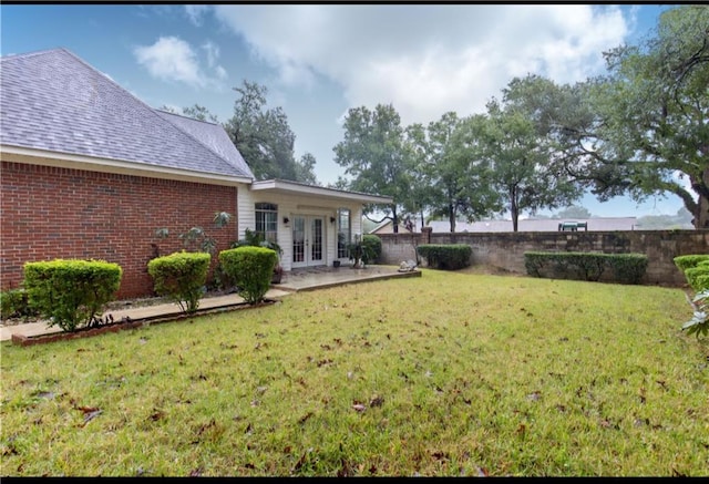 view of yard with french doors