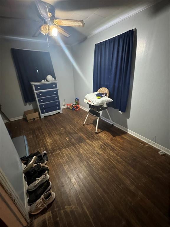 bedroom featuring ceiling fan and hardwood / wood-style flooring