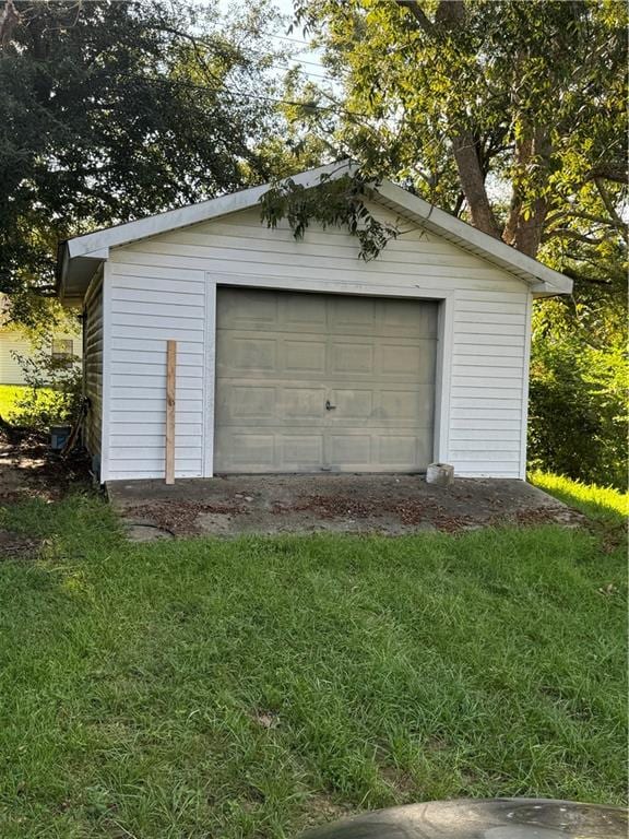 garage with a yard