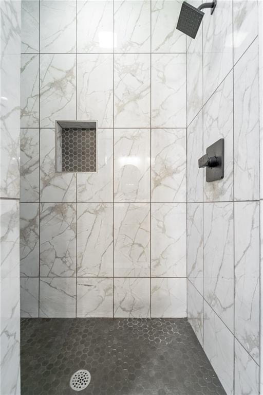 bathroom with tiled shower