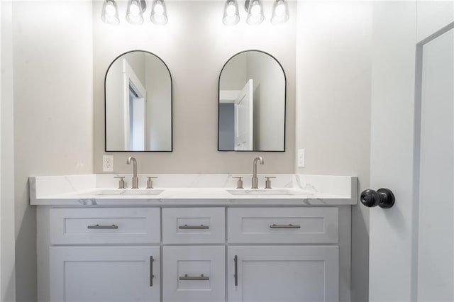 bathroom featuring double vanity and a sink
