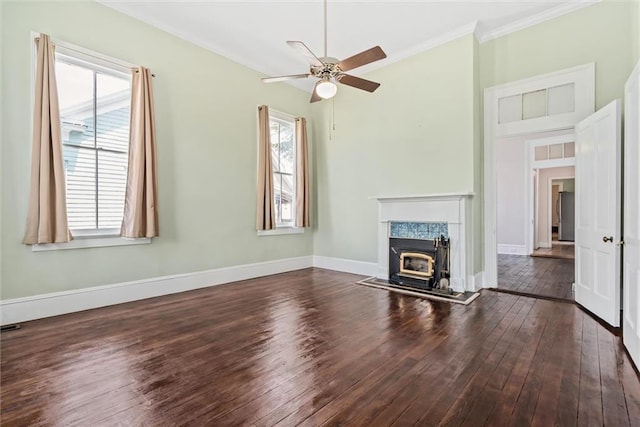 unfurnished living room with ceiling fan, plenty of natural light, dark wood-type flooring, and a high end fireplace