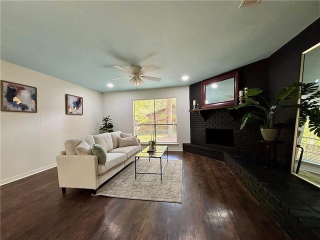 332 Syracuse St, Mobile, AL 36608 - living area featuring a ceiling fan, baseboards, dark wood-style flooring, a brick fireplace, and recessed lighting
