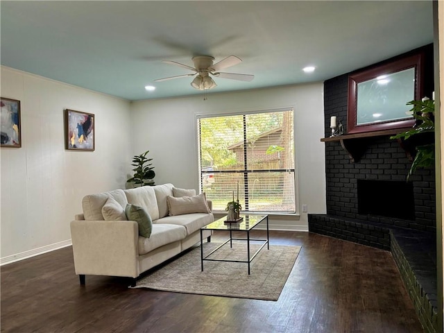 332 Syracuse St, Mobile, AL 36608 - living area with baseboards, a ceiling fan, dark wood finished floors, recessed lighting, and a fireplace