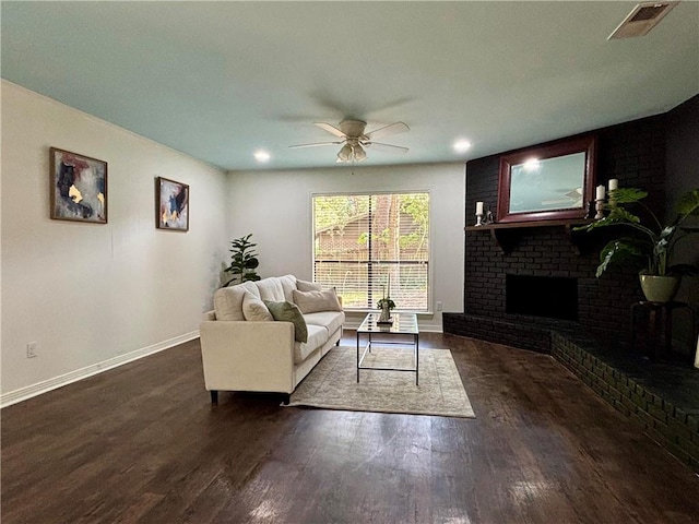 332 Syracuse St, Mobile, AL 36608 - living area with baseboards, wood finished floors, a ceiling fan, and a brick fireplace