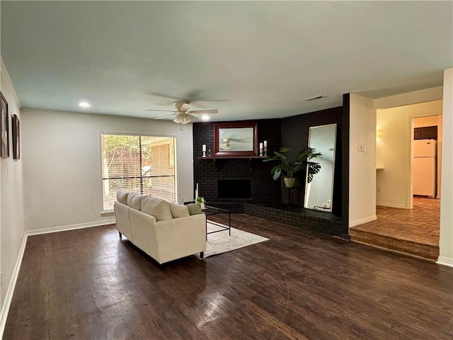332 Syracuse St, Mobile, AL 36608 - living area featuring ceiling fan, baseboards, wood finished floors, a brick fireplace, and recessed lighting