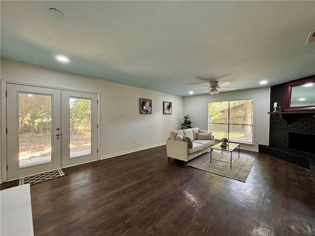 332 Syracuse St, Mobile, AL 36608 - living area featuring wood finished floors, a ceiling fan, french doors, recessed lighting, and a brick fireplace