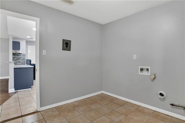 laundry area with washer hookup, hookup for a gas dryer, and light tile patterned floors