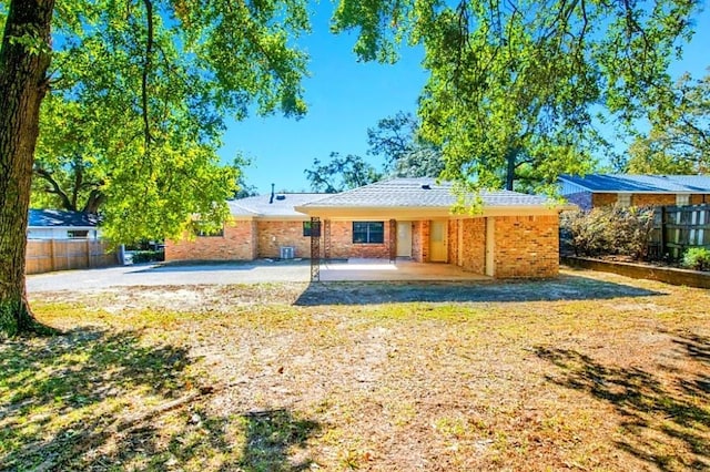 back of property featuring a patio area