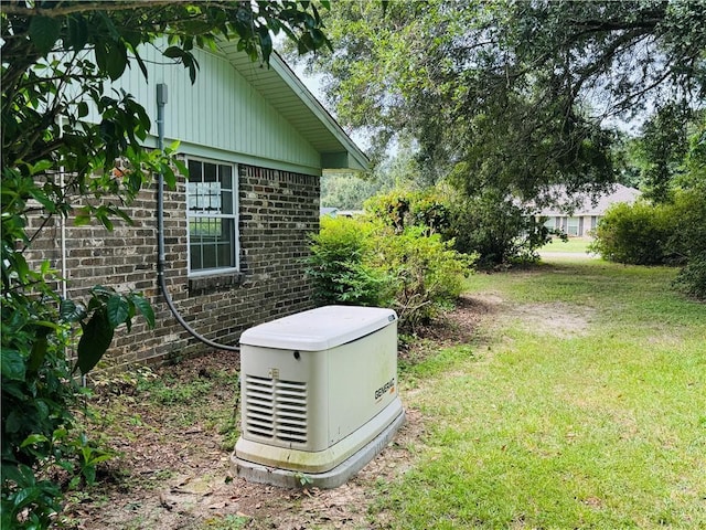 details featuring a power unit and brick siding