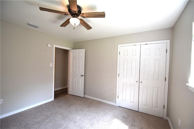 unfurnished bedroom featuring carpet, a closet, and ceiling fan