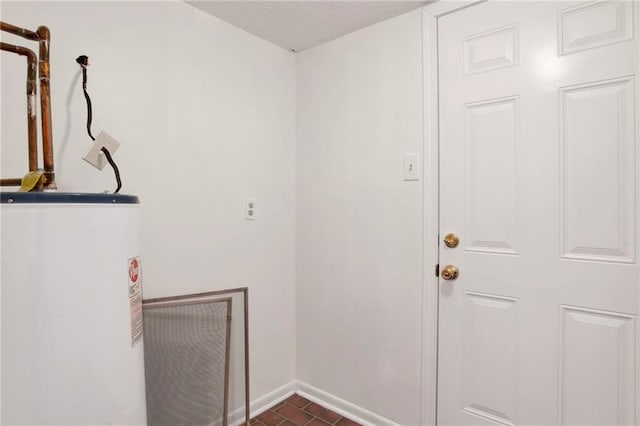 4017 Cottage Hill Rd Unit 17, Mobile, AL 36609 - laundry area featuring water heater and baseboards