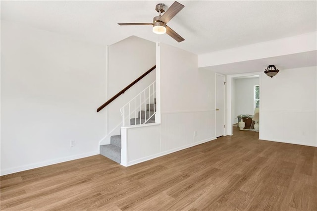 4017 Cottage Hill Rd Unit 17, Mobile, AL 36609 - unfurnished living room with wood finished floors, a ceiling fan, and stairs