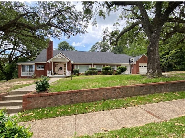 single story home with a garage and a front lawn