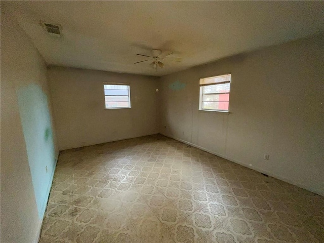 unfurnished room featuring ceiling fan