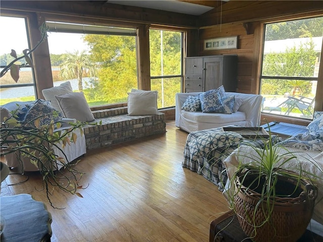 12236 Boulet Dr, Coden, AL 36523 - living room featuring healthy amount of natural light, wooden walls, and wood finished floors