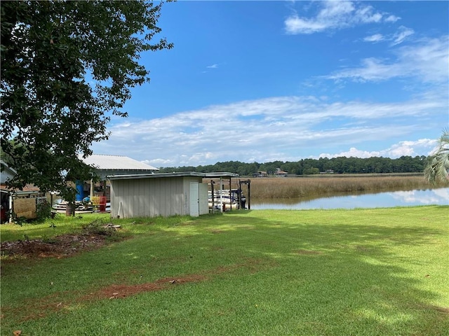 12236 Boulet Dr, Coden, AL 36523 - dock area with a water view and a lawn
