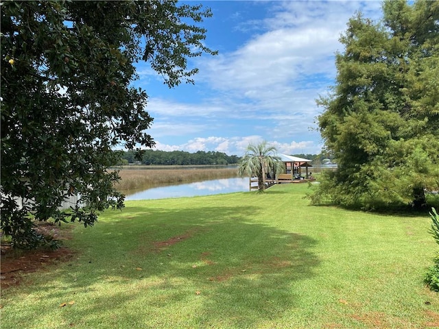 view of yard featuring a gazebo and a water view