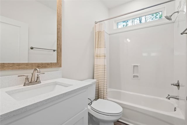 full bathroom with toilet, shower / bath combination with curtain, and vanity