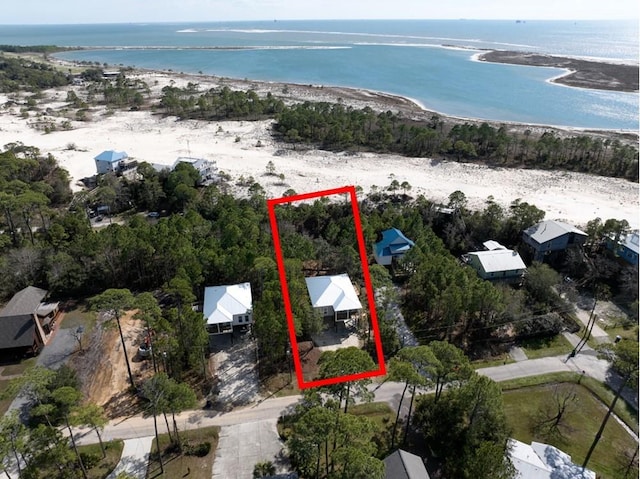 aerial view with a water view and a view of the beach