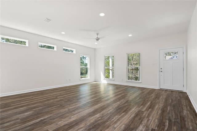 spare room with ceiling fan and dark hardwood / wood-style floors