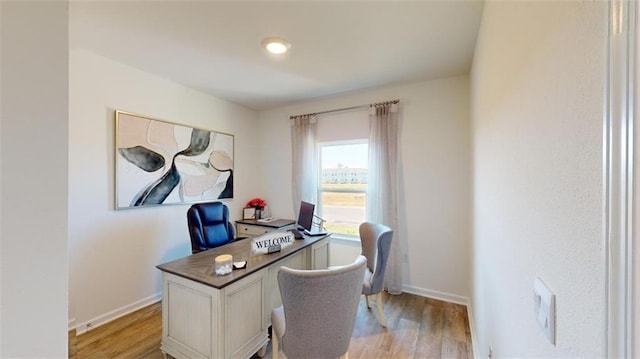 office space with light wood-type flooring