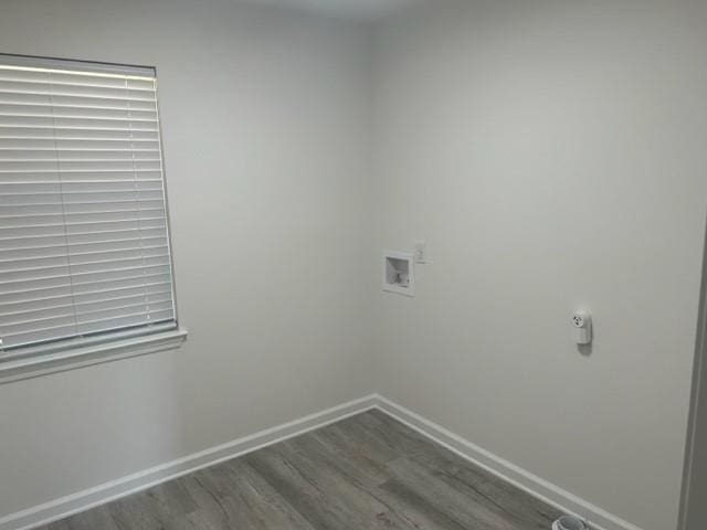 laundry area featuring hookup for a washing machine and hardwood / wood-style floors