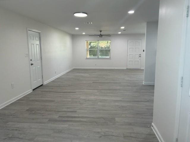 unfurnished room featuring hardwood / wood-style floors and ceiling fan