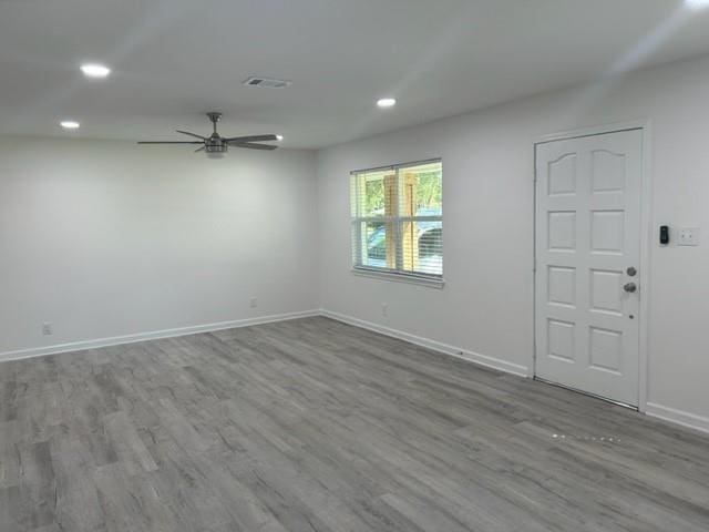 unfurnished room featuring wood-type flooring and ceiling fan