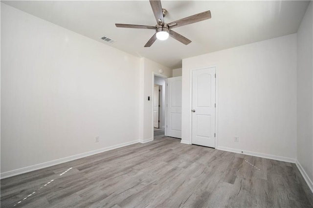 unfurnished bedroom with ceiling fan and light hardwood / wood-style flooring