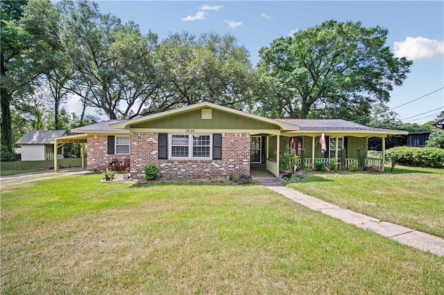 5459 Racine Ave, Mobile, AL 36618 - ranch-style house featuring brick siding, an attached carport, a front yard, and a porch