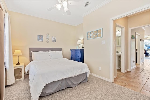 bedroom featuring ceiling fan, crown molding, and light colored carpet